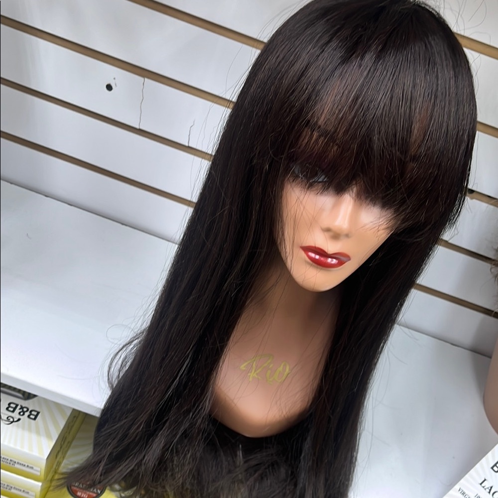 - Natural brown textured wig with bang